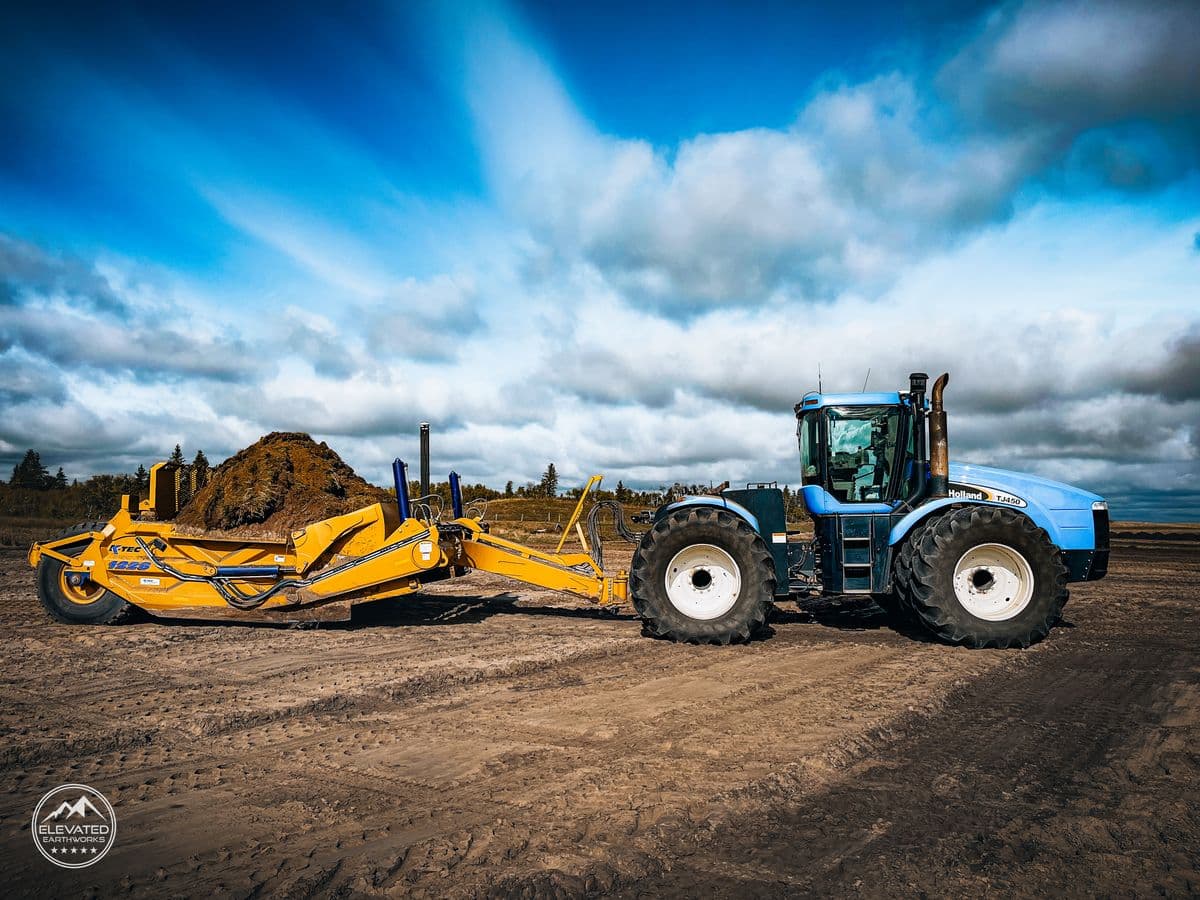 Heavy earthmoving equipment at golden hour